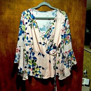 Beautiful. Faux wrap blouse.  Sheer sleeves.  Tie front detail.